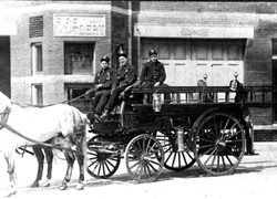 Firemen on truck in 1900 